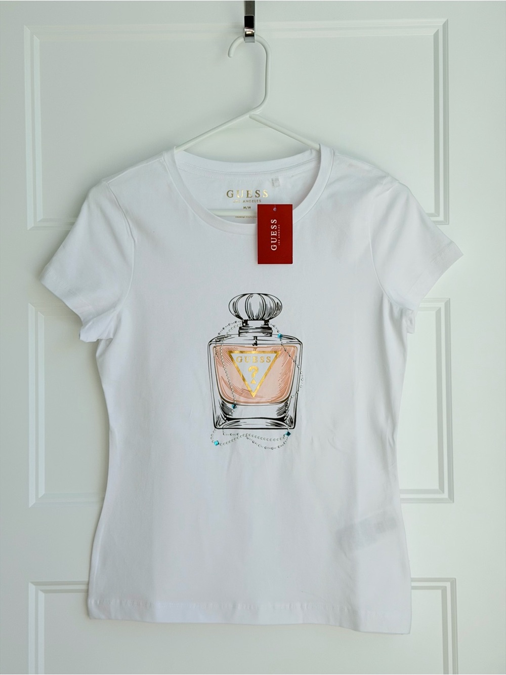 Guess White Tee with Pink & Gold Perfume Bottle Graphic